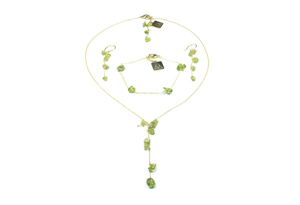 GOLDEN STAINLESS STEEL SET WITH A PERIDOT CASCADE